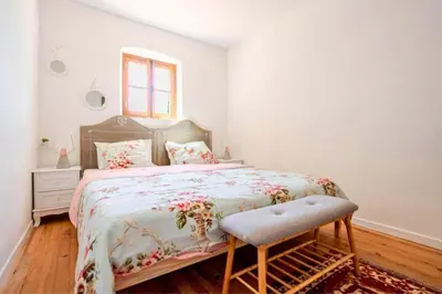 a bedroom with a large bed and a window at Joli mas 