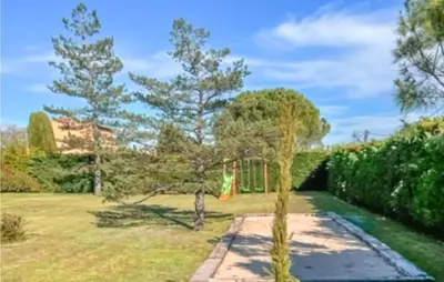 a garden with two trees and a lawn at 3 Bedroom Gorgeous Home In Gargas in Gargas