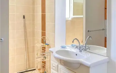 a bathroom with a sink and a shower at 3 Bedroom Gorgeous Home In Gargas in Gargas