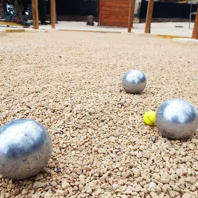 three balls are sitting on the ground at Appartement charmant à Avignon, 45 m² avec piscine partagée in Avignon