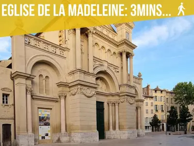 a large building with a banner in front of it at Le Petit Patio in Aix-en-Provence
