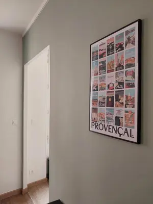 a painting hanging on a wall in a room at Le Mistralet in Salon-de-Provence