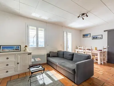 a living room with a couch and a table at Holiday Home La Campagne des Ocres by Interhome in Rustrel