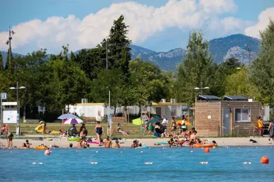 a group of people on a beach in the water at Appartement climatisé avec cour en centre ville in Carpentras