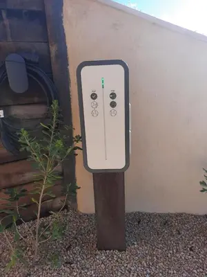 a pole with a electrical box in front of a building at BASTIDE DU DEFENDS in Pertuis