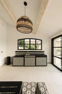 a living room with white walls and a ceiling at MAISON LAVANDE du MAS LOU CAPY in Salon-de-Provence
