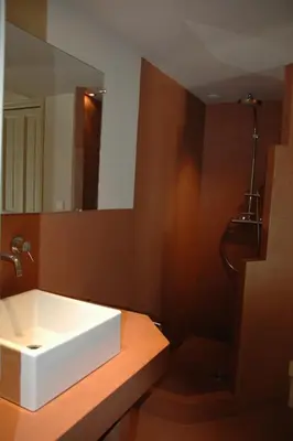 a bathroom with a white sink and a mirror at Property with panoramic views in Cabrières-dʼAvignon