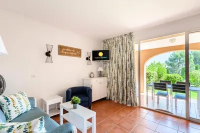 a living room with a couch and a table at Village Pont Royal en Provence - maeva Home - Appartement décoré avec goût et climatisé 2 pièces 5 personnes - Prestige - super Home MAE-1144 in Mallemort
