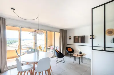 a dining room with a white table and chairs at Village Pont Royal en Provence - maeva Home - Appartement cosy et climatisé 3 pièces 6 personnes - Prestige - super Home MAE-3914 in Mallemort