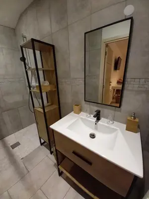 a bathroom with a white sink and a mirror at A Ventoux Yourte in Monieux