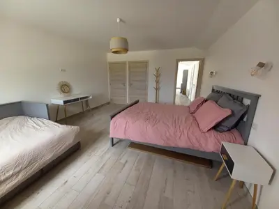 a bedroom with two beds with pink sheets at A Ventoux Yourte in Monieux