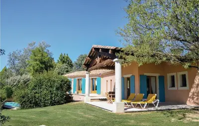 a villa with a view of the garden at Amazing Home In Roussillon With Wifi in Roussillon