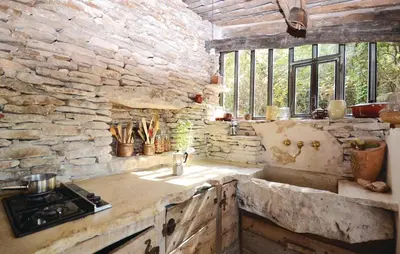a kitchen with a sink and a stone wall at 1 Bedroom Beautiful Home In Saignon in Saignon