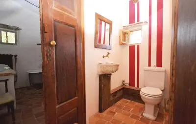 a bathroom with a toilet and a sink at 1 Bedroom Beautiful Home In Saignon in Saignon