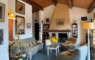 a small house with chairs and a porch at Mas Mirasol in Gargas