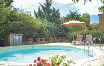 a patio with chairs and a view of a garden at Mas Mirasol in Gargas