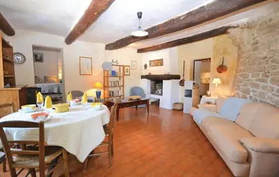 a living room with a couch and a table at 3 Bedroom Nice Home In Bonnieux in Bonnieux
