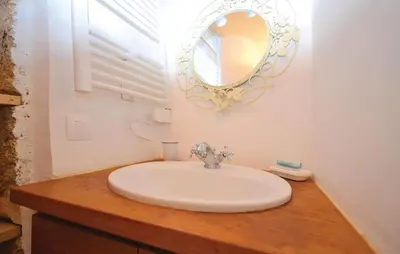a bathroom with a sink and a mirror on a counter at 3 Bedroom Nice Home In Bonnieux in Bonnieux