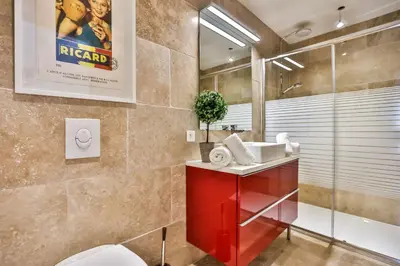 a bathroom with a red sink and a shower at Apartments - Experience of PROVENCE in Gordes