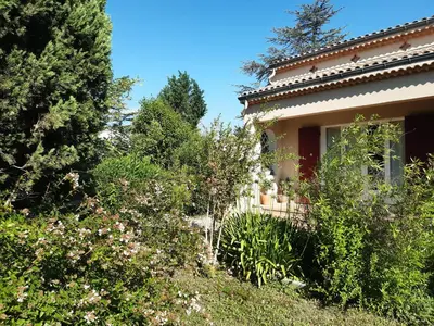 a house with trees and plants in front of it at Villa 