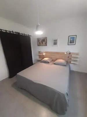 a bedroom with a large white bed in a room at Villa 