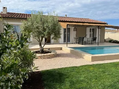 a house with a swimming pool in a yard at Villa Provençale avec Piscine Chauffée in Saint-Andiol