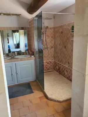 a bathroom with a shower and a sink at Villa L'Estagniol in Lourmarin