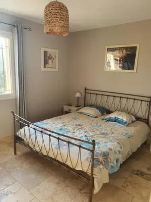 a bedroom with a bed in a room at Villa L'Estagniol in Lourmarin