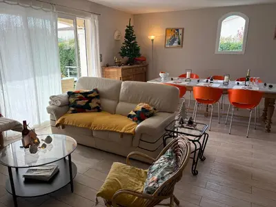 a living room with a couch and a table at Proche Saint Rémy de Provence in Mollégès