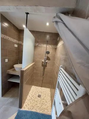 a bathroom with a shower and a sink and a staircase at Escapade romantique au cœur du Luberon, Piscine, calme et vue magique in Viens