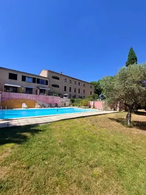 a swimming pool in front of a building at Escapade romantique au cœur du Luberon, Piscine, calme et vue magique in Viens