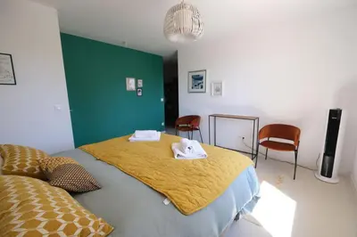 a bedroom with a bed with two towels on it at superb villa with private pool, with magnificent view of the luberon, in the heart of provence, 8 persons in Puget