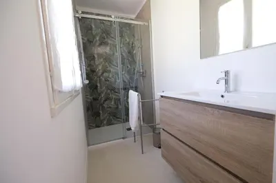 a bathroom with a shower and a sink at superb villa with private pool, with magnificent view of the luberon, in the heart of provence, 8 persons in Puget