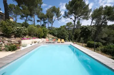 a swimming pool in a yard with trees at superb villa with private pool, with magnificent view of the luberon, in the heart of provence, 8 persons in Puget