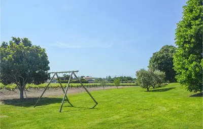 a swing set in a field of green grass at Nice Home In Lançon-Provence in Lançon-Provence