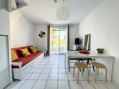 a living room with a couch and a table and chairs at Casa De Provence in Saint-Saturnin-les-Avignon