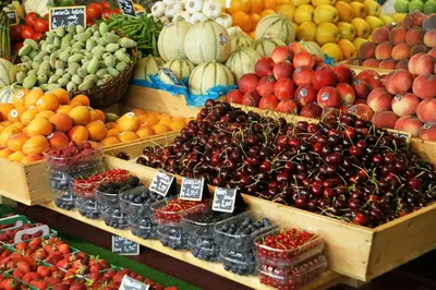 a display of fruits and vegetables in a market at Provence Now in Cabrières-dʼAvignon