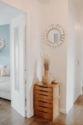 a room with a dresser and a mirror on a wall at Superbe appartement rénové - Salon de Provence in Salon-de-Provence