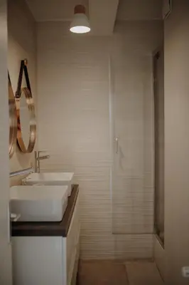a bathroom with a sink and a shower at Superbe appartement rénové - Salon de Provence in Salon-de-Provence