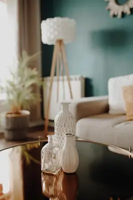 two white vases sitting on a table in a living room at Superbe appartement rénové - Salon de Provence in Salon-de-Provence