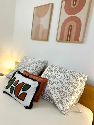 a bedroom with two pillows on a bed at Maisonnette avec terrasse privée au calme absolu - proche LOURMARIN in Cadenet