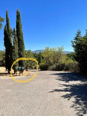 a yellow hula hoop in a park with a bench at Maisonnette avec terrasse privée au calme absolu - proche LOURMARIN in Cadenet