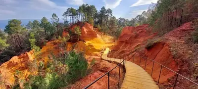 a staircase leading to a canyon with red rocks at A l'ombre de l'Olivier Spacieux Clim Parking Cosy in LʼIsle-sur-la-Sorgue