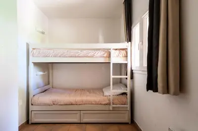 a bunk bed room with two bunk beds at Village Pont Royal en Provence - maeva Home - Studio 5 personnes - Sélection MAE-2824 in Mallemort