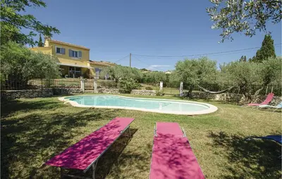 a pool with a pink bench in the yard at Amazing Home In Caumont Sur Durance in Caumont-sur-Durance