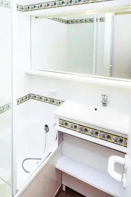 a bathroom with a sink and a mirror at Village Pont Royal en Provence - maeva Home - Appartement 2 Pièces 5 Personnes Sélection MAE-2164 in Mallemort
