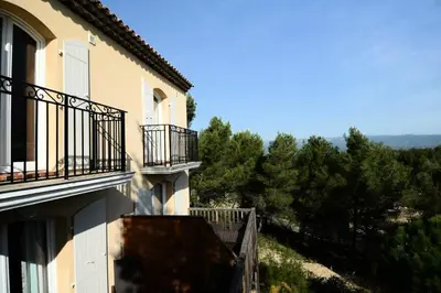a building with balconies and a view of trees at Les Coteaux de Pont Royal en Provence - maeva Home - Appartement 2 Pièces 4 Personnes - Confort MAE-6002 in Mallemort