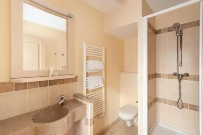 a bathroom with a sink and a shower and a toilet at Les Coteaux de Pont Royal en Provence - maeva Home - Maison 4 Pièces 8 Personnes - Budget MAE-6009 in Mallemort