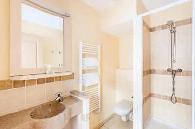 a bathroom with a sink and a shower at Les Coteaux de Pont Royal en Provence - maeva Home - Maison 4 Pièces 8 Personnes - Sélection MAE-6014 in Mallemort