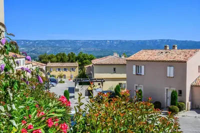 a view of a village with flowers at Les Coteaux de Pont Royal en Provence - maeva Home - Appartement climatisé 2 Pièces 4 Personnes - Sélection MAE-6022 in Mallemort